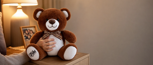 Voice recordable teddy bear on night stand.