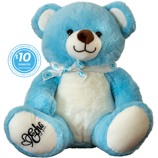 Blue teddy bear with a white chest, wearing a bow tie, on a white background.